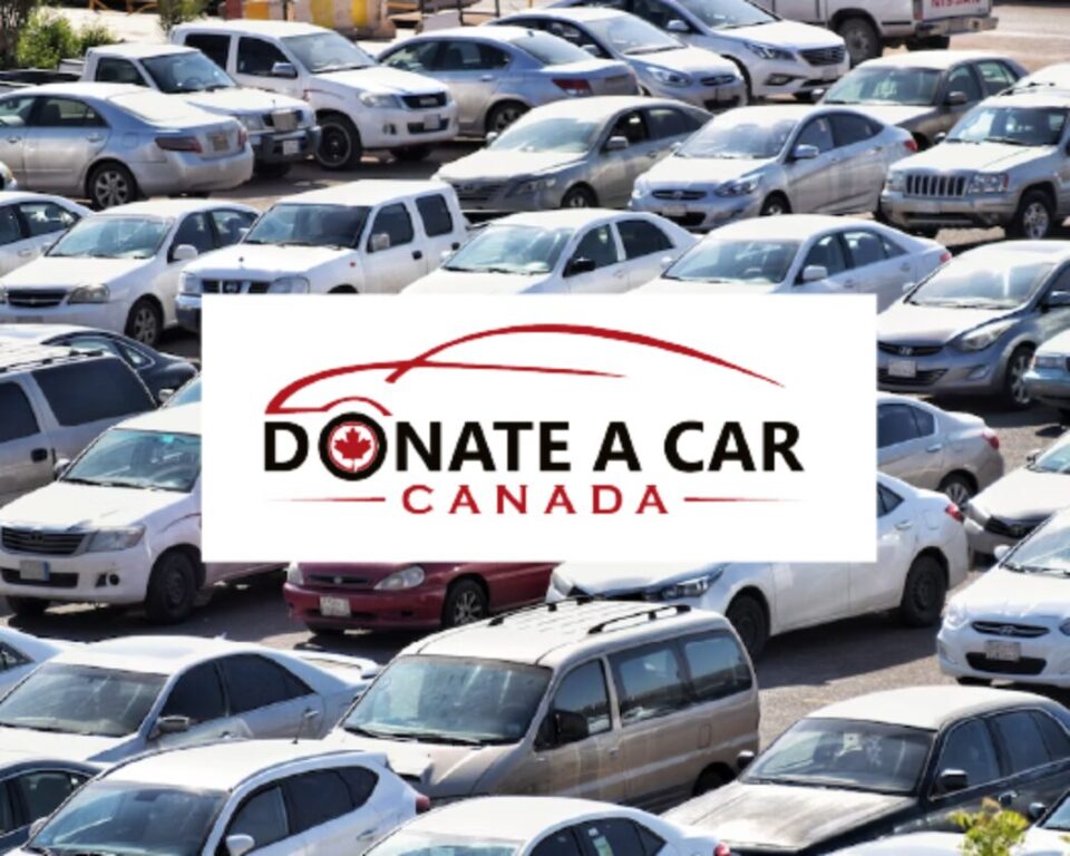 Parking lot filled with various cars, overlaid with 'Donate a Car Canada' logo featuring a red car outline and a maple leaf. Promotes car donation.